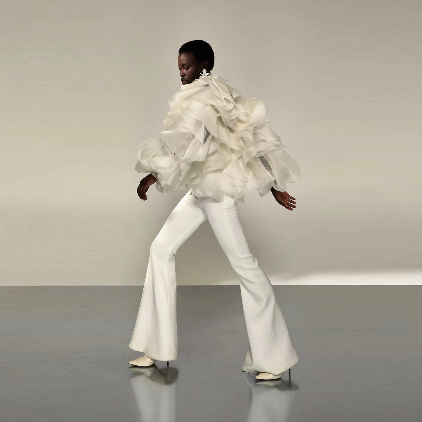 Avant-garde unique suit with voluminous ruffles and modern silhouette