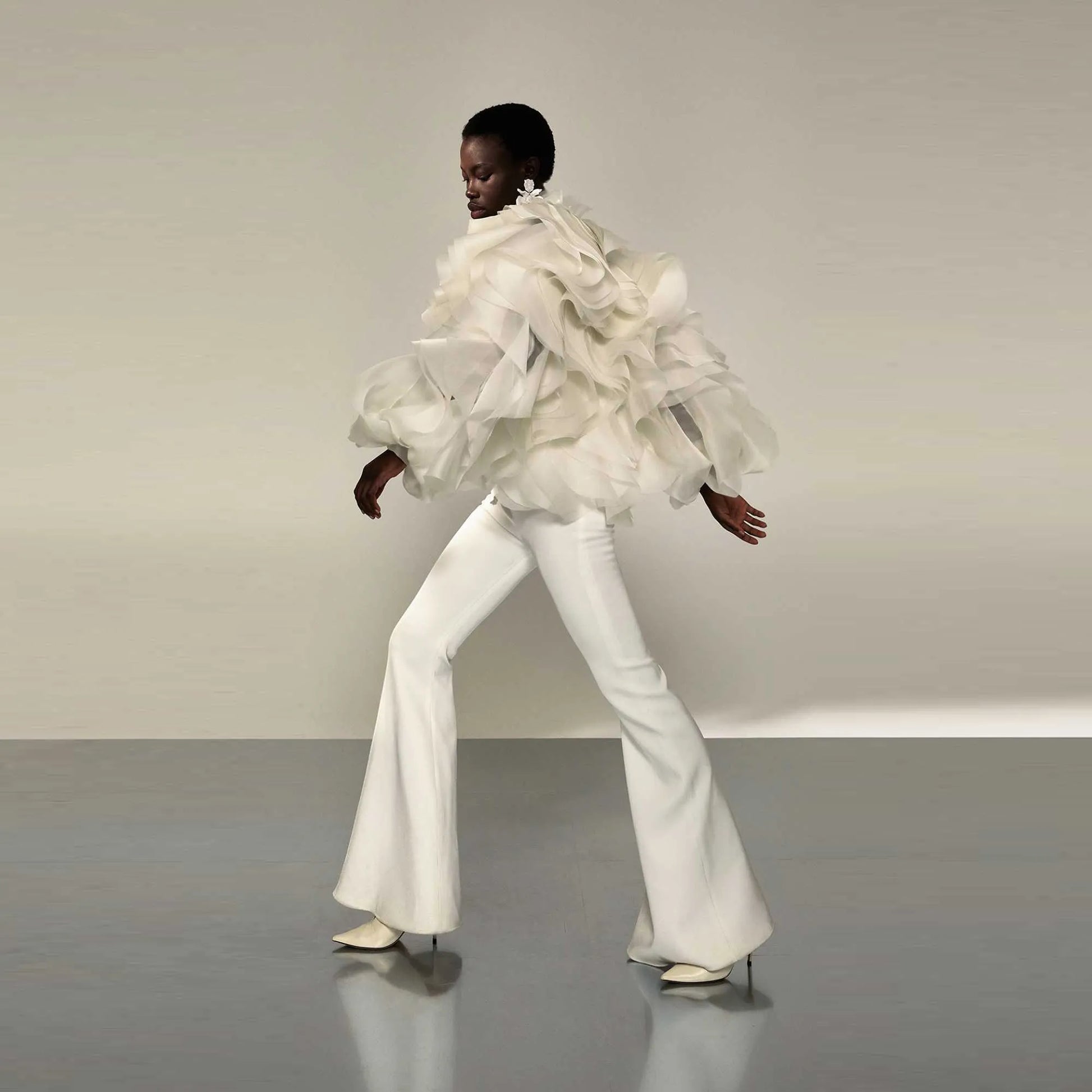 Avant-garde unique suit with voluminous ruffles and modern silhouette