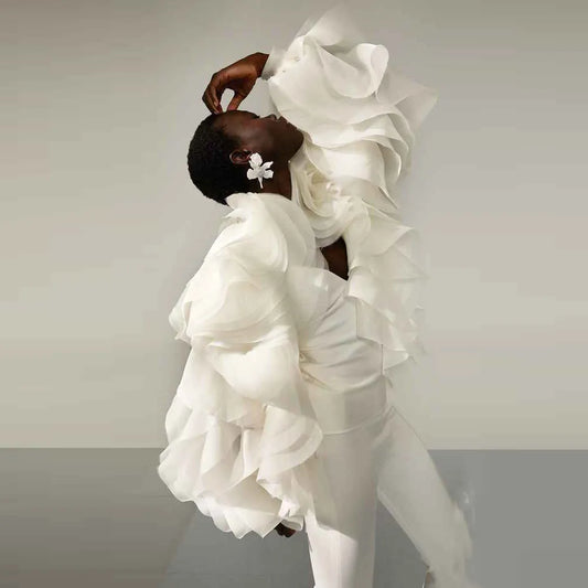 Unique white ruffled suit with dramatic layered sleeves and tailored fit